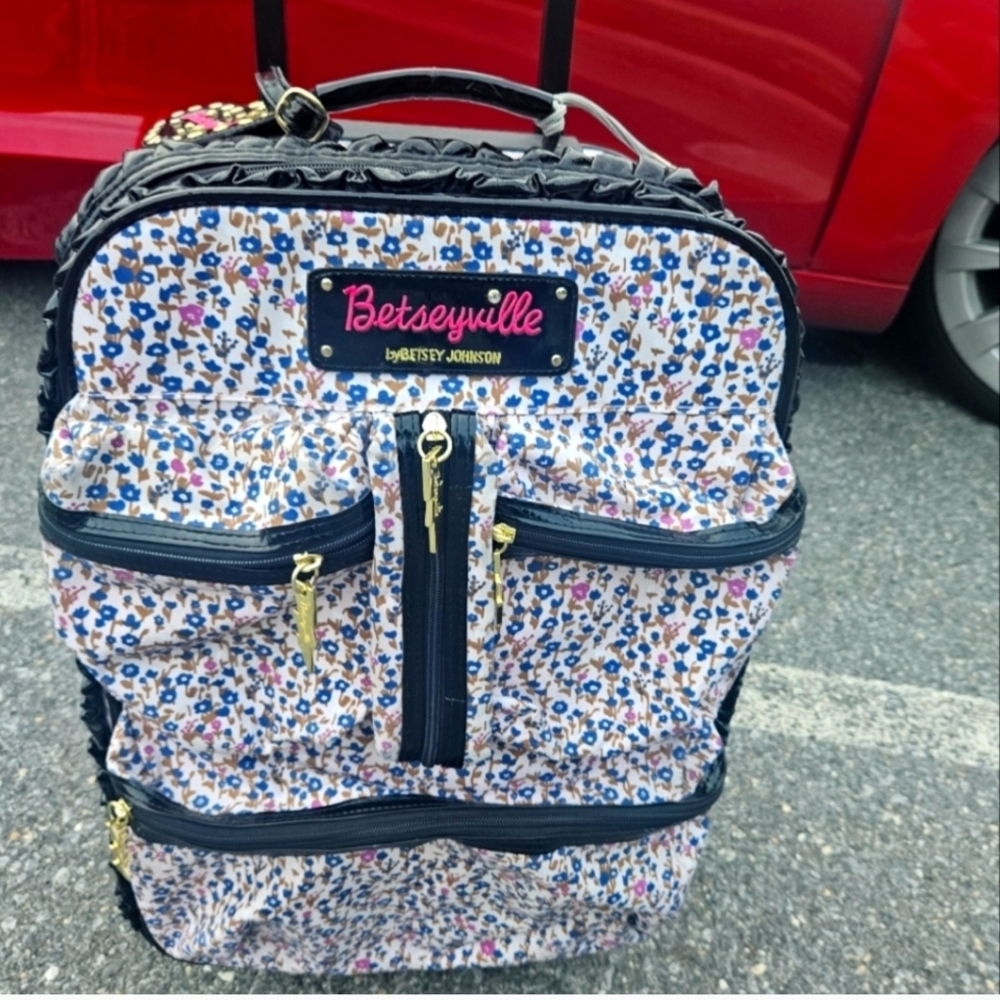 Betsey Johnson - carry on suitcase and floral shoulder bag.